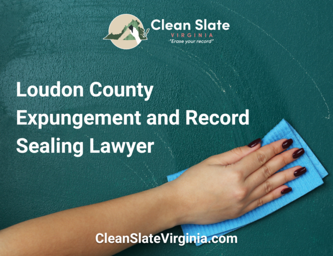 An image with a hand cleaning a chalkboard